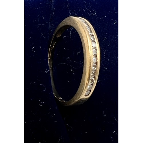 532 - A nine carat gold ring set with clear stones. Size M. Weight 1.3gm.