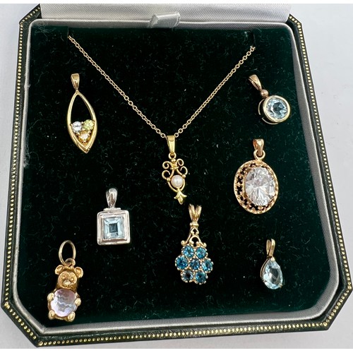 538 - Five 9 carat gold gem set pendants, one on a 9 carat gold chain, one 14 carat gold pendant set with ... 