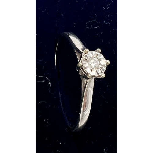 539 - A nine carat white gold solitaire diamond ring. Size O, weight 1.4gm.