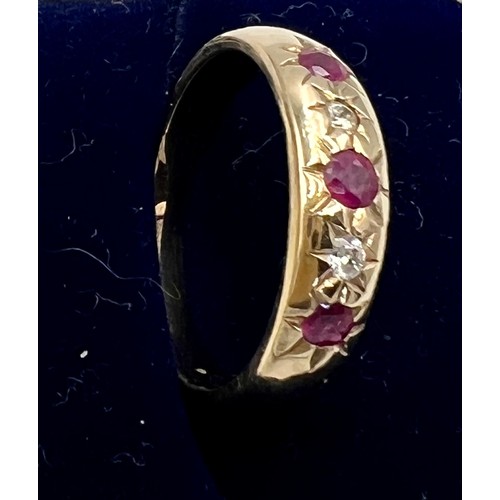 541 - A nine carat gold ring set with pink and clear stones. Size M. Weight 3gm.