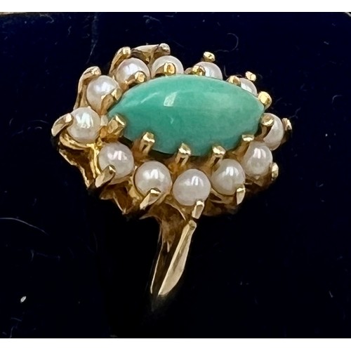 542 - A nine carat gold ring set with turquoise and seed pearls. Size M. Weight 2.9gm.