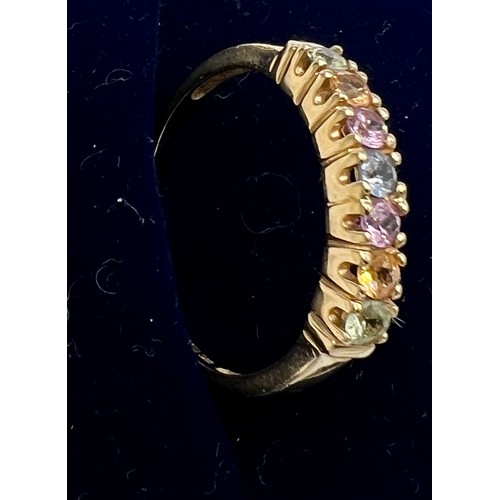 546 - A nine carat gold gem set ring. Size R. Weight 2gm.