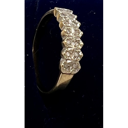 548 - A nine carat gold diamond set ring. Size Q/R. Weight 2gm.