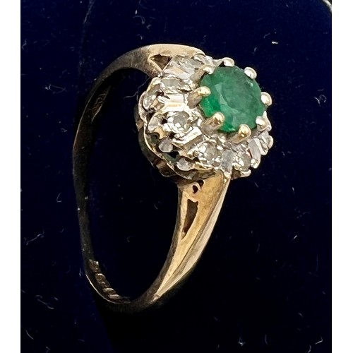 553 - A nine carat gold cluster ring set with green and clear stones. Size M/N. Weight 2.3gm.