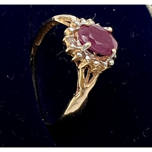 555 - A 10 carat gold cluster ring set with pink and clear stones. Size N. Weight 1.3gm.