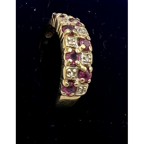 557 - A nine carat gold ring set with pink and white stones. Size M. Weight 2.4gm.