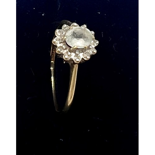 558 - A nine carat gold pale blue and clear stone cluster ring. Size N/O. Weight 1.5gm.