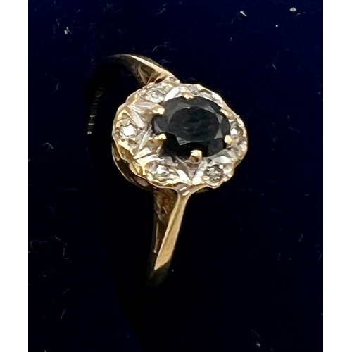 571 - A 9 carat gold cluster ring with blue and clear stones. Size M. Weight 1.4gm.