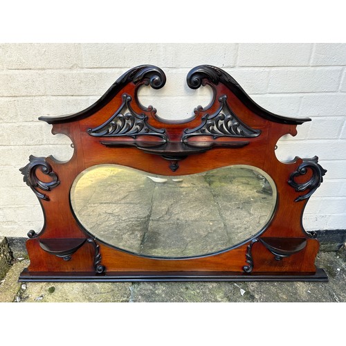 135 - An Edwardian mahogany and ebony over mantel mirror. 127cm w x 83cm h.