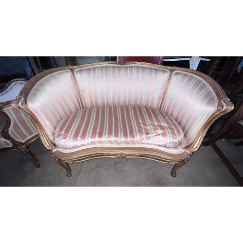 136 - Two 19thC giltwood sofas in the French style upholstered in striped silk. 155cm l x 63cm d x 93cm h ... 