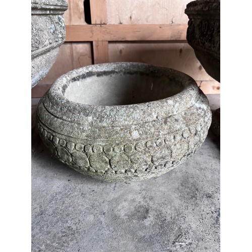 12 - Two reconstituted stone urns 53cm d x 43cm h marked Pan-Art together with a circular reconstituted s... 