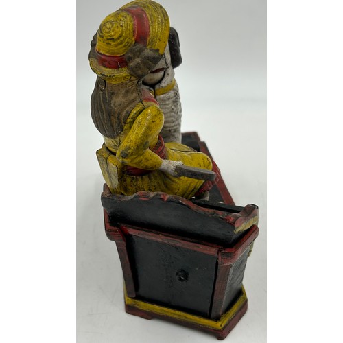 1361 - A cast iron money automated money box, Speaking Dog, 18cm w x 7cm d x 19cm h. Together with a 20thC ... 