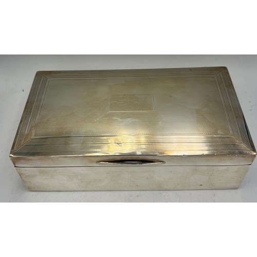 928 - A hallmarked silver cigarette box. 17cm x 8 cm x 5cm h. Birmingham 1939.