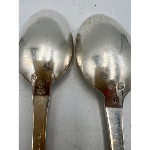 930 - A pair of .925 silver spoons, maker Georg Jensen Weight 129gm. Length 20.5cm.