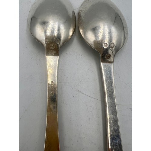 930 - A pair of .925 silver spoons, maker Georg Jensen Weight 129gm. Length 20.5cm.