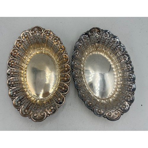 932 - A pair of pierced oval silver dishes, 12cm x 8cm, weight 60gm. Sheffield 1897, maker James Dixon & S... 