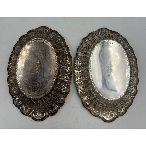 932 - A pair of pierced oval silver dishes, 12cm x 8cm, weight 60gm. Sheffield 1897, maker James Dixon & S... 