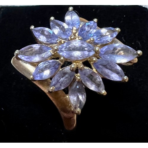 595 - A pair of tanzanite cluster earrings in 9 carat gold together with a tanzanite cluster ring in 9 car... 