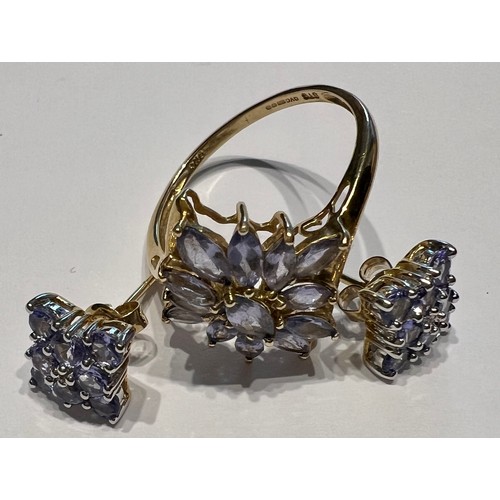 595 - A pair of tanzanite cluster earrings in 9 carat gold together with a tanzanite cluster ring in 9 car... 