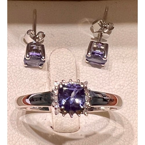 598 - An 18 carat white gold tanzanite and diamond ring, size V, weight 3.4gm together with a pair of tanz... 