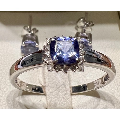 598 - An 18 carat white gold tanzanite and diamond ring, size V, weight 3.4gm together with a pair of tanz... 