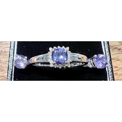 598 - An 18 carat white gold tanzanite and diamond ring, size V, weight 3.4gm together with a pair of tanz... 