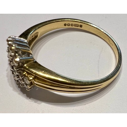 604 - An 18 carat gold ring set with multiple clear stones. Size O/P. Weight 3.5gm.