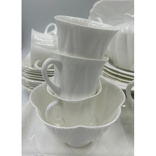 343 - Shelley white glazed porcelain tea service with two registration numbers 735121 and 272101 consistin... 