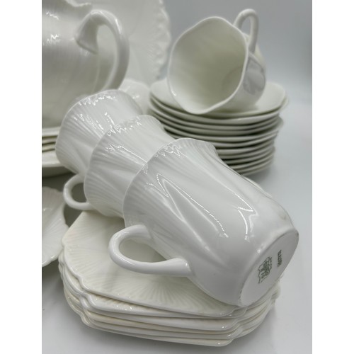 343 - Shelley white glazed porcelain tea service with two registration numbers 735121 and 272101 consistin... 