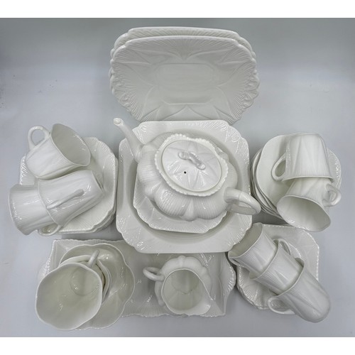 343 - Shelley white glazed porcelain tea service with two registration numbers 735121 and 272101 consistin... 