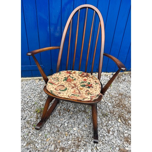 139 - An Ercol rocking chair with original blue paper label.