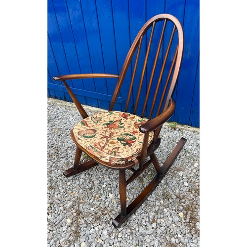 139 - An Ercol rocking chair with original blue paper label.