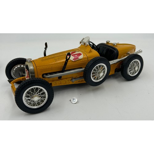 1329 - A Zebra Toys AA patrol motor bike along with two Burago racing cars scale 1/18 comprising of an Alfa... 