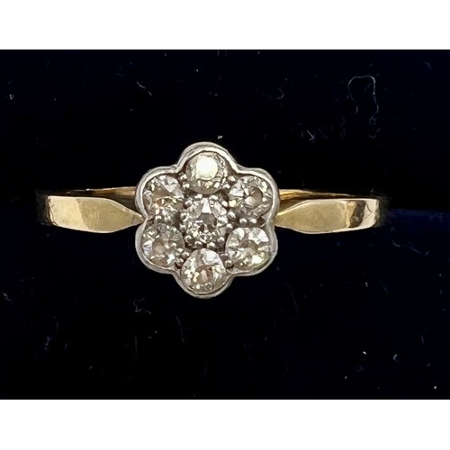 613 - An 18 carat gold diamond cluster ring. Size Q/R, weight 2.4gm.