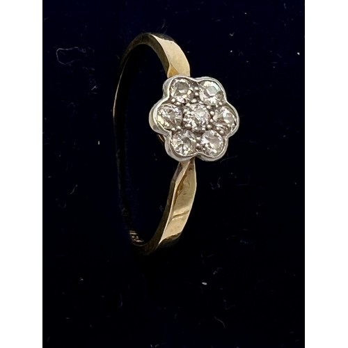 613 - An 18 carat gold diamond cluster ring. Size Q/R, weight 2.4gm.