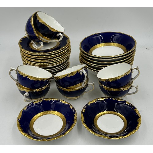 344 - A quantity of Coalport gilt and cobalt porcelain plates etc, some marked 'Cellini' others with blue ... 