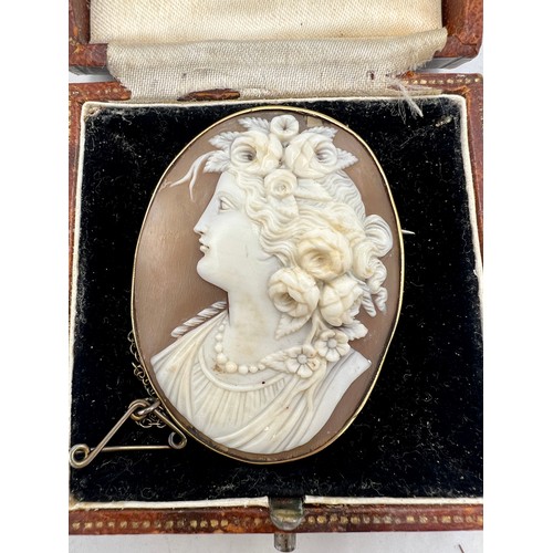 520 - A carved shell cameo brooch in yellow metal mount, 9ct marked to on side. Weight 13.1gm. 5cm x 4cm c... 