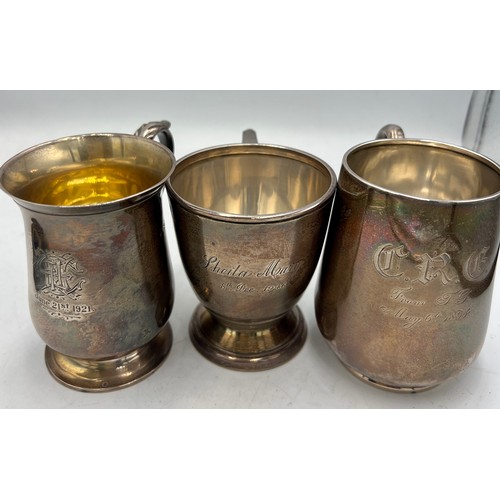 937 - Hallmarked silver to include three mugs, two photograph frames, shell caddy spoon, Mordan Everpoint ... 