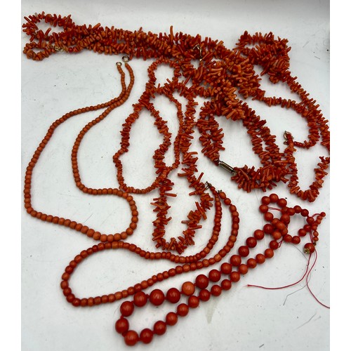 576 - A large quantity of vintage coral beads, some in need of rethreading. One necklace with 9 carat gold... 