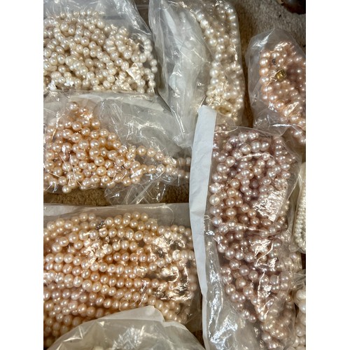 578 - A large quantity of cultured, seed and simulated pearl necklaces and loose beads.