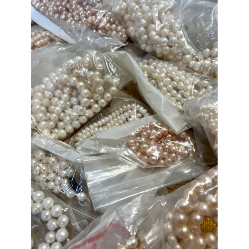 578 - A large quantity of cultured, seed and simulated pearl necklaces and loose beads.