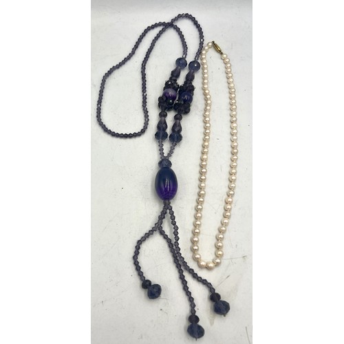 581 - Cultured pearl necklace with 9 carat gold clasp together with a purple glass bead necklace.