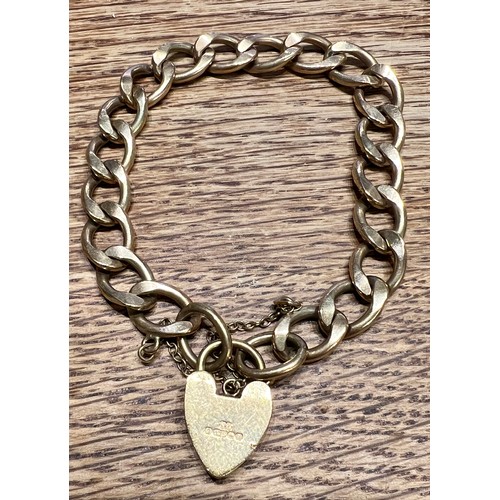 586 - A nine carat gold chain bracelet with heart shaped padlock fastener and safety chain. Weight 25.8gm.