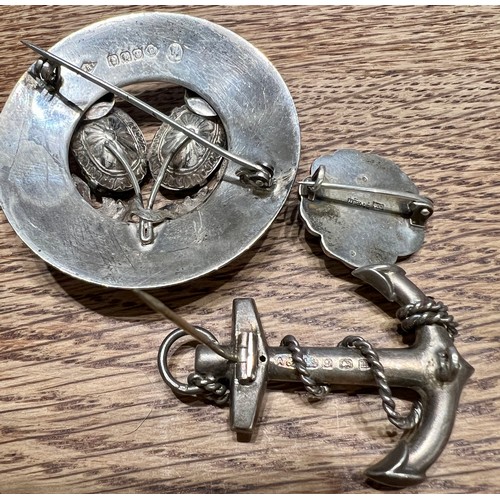 592 - Three silver brooches to include Glasgow 1952, maker Ward Bros, anchor brooch Birmingham 1886 and a ... 