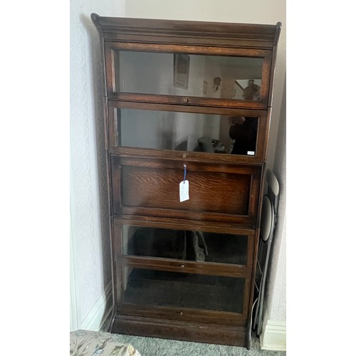 21 - An oak five section globe wernike style bookcase, four glazed sections and one solid door with fitte... 