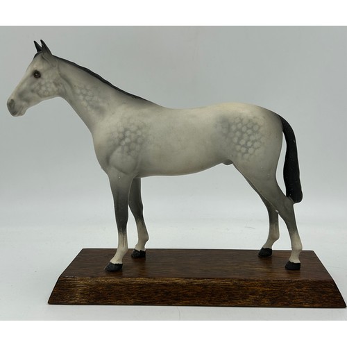 438 - Four Beswick Horses Connoisseur Series - Arab, Spirit of the Wind, Black Beauty and a bay all on woo... 