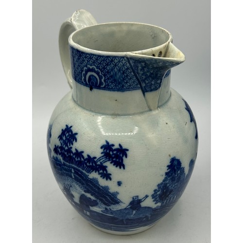 180 - A group of early 19th century blue and white transfer-printed jugs and a mug, c. 1800-10. To include... 