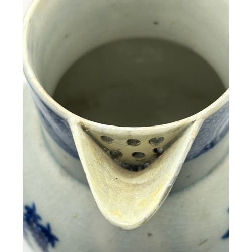 180 - A group of early 19th century blue and white transfer-printed jugs and a mug, c. 1800-10. To include... 