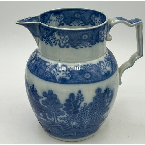 180 - A group of early 19th century blue and white transfer-printed jugs and a mug, c. 1800-10. To include... 