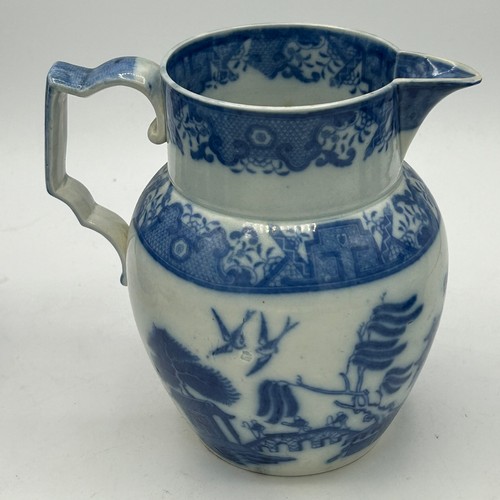 180 - A group of early 19th century blue and white transfer-printed jugs and a mug, c. 1800-10. To include... 